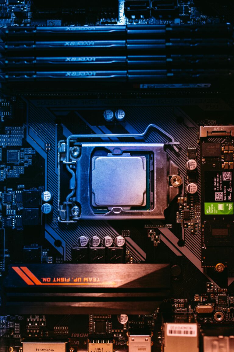 Detailed view of a computer motherboard featuring a central processor and RAM slots, highlighting its intricate design.